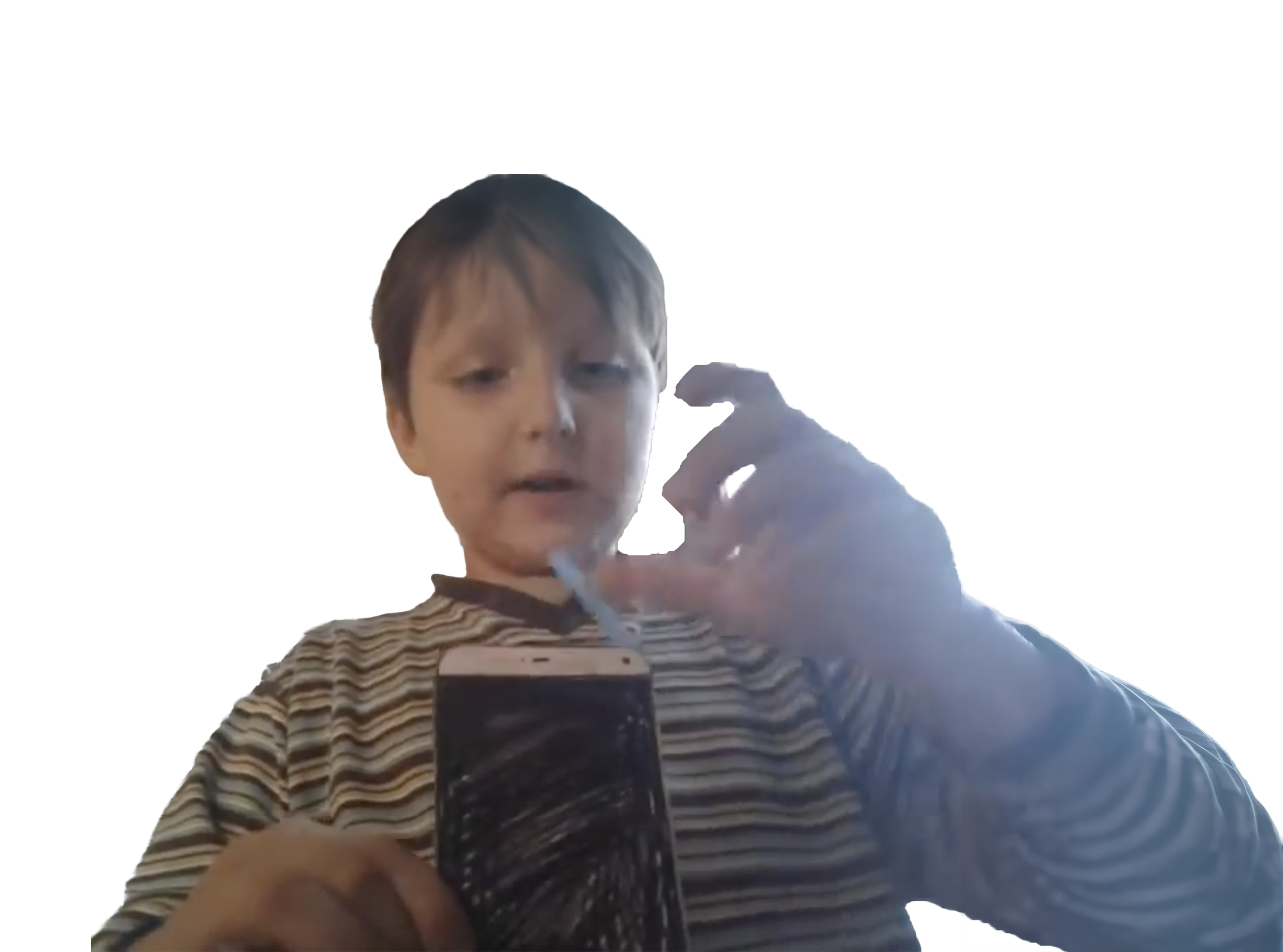 Ivan showing a cardboard phone he made in 2016